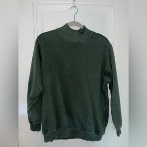 High neck sweater with pockets.